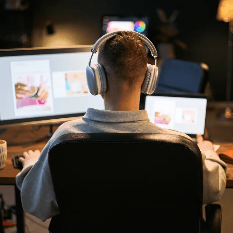 Specialist working on social media content at a computer