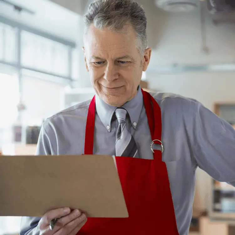 Man reviewing a task list on a tablet