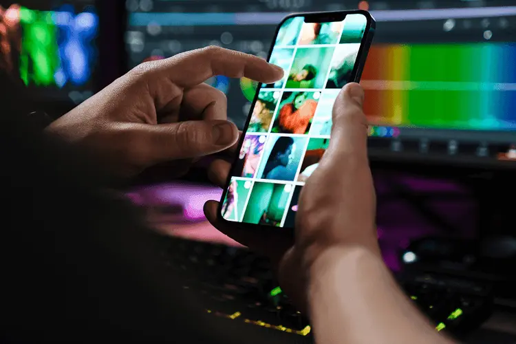 A phone in hand with a short video editing app open