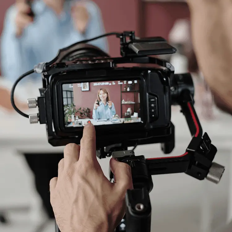 Content creator filming a short social media video with the Illia BizTech team
