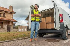 Service van parked outside a customer's house as a tradesperson arrives