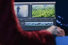 Editing an ad video on a laptop screen with a visible timeline